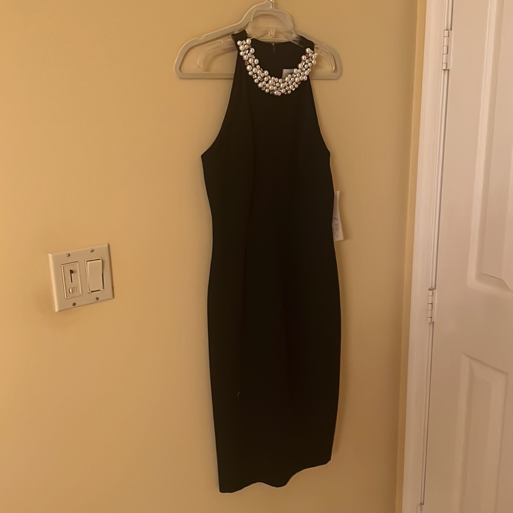 Beautiful black dress with pearl detailed neckline